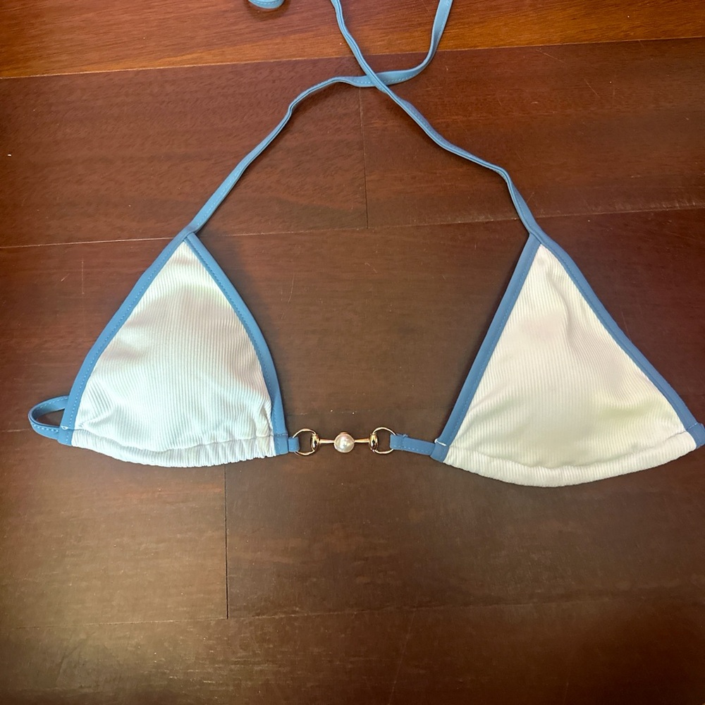 SHEIN size small white bikini top with blue outline and pearl in the middle